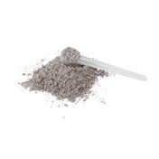 Närbild på mini ferrum hemjärnspulver till barn med en doseringskopa