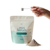 Mini ferrum hemjärnpulver till barn med doseringsskopa och järnpulver i en hög