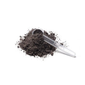 Närbild på Feméa hemjärnspulver med en doseringsskopa